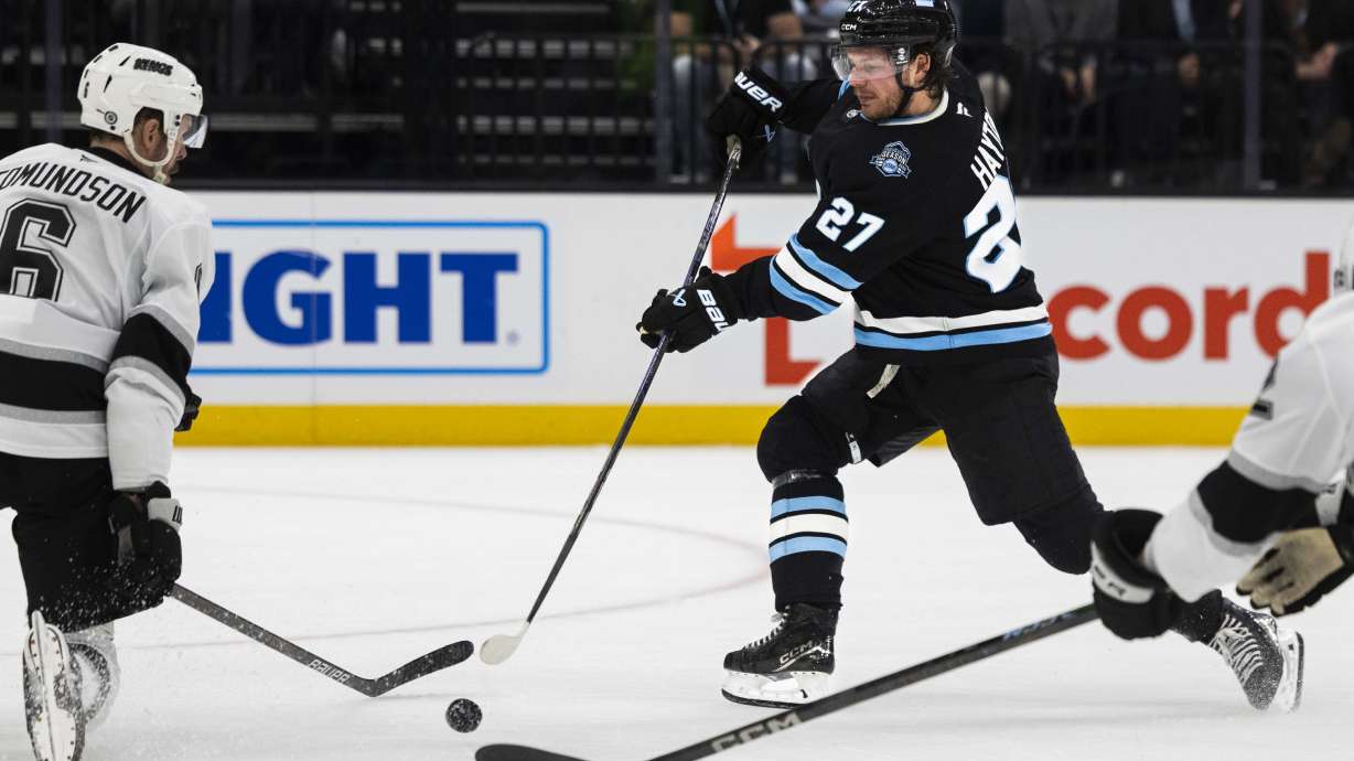 Utah Hockey Club center Barrett Hayton (27) takes a shot at the goal during an NHL game between the Utah Hockey Club and the Los Angeles Kings at the Delta Center in Salt Lake City on Thursday, April 3, 2025.