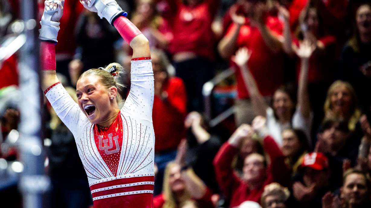 Utah’s Avery Neff celebrates after performing on the bars as they compete in the NCAA regional semifinals for gymnastics at the Jon M. Huntsman Center in Salt Lake City on Thursday, April 3, 2025.