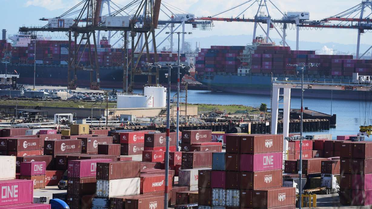 Containers are stacked at the Port of Los Angeles Wednesday in Los Angeles.