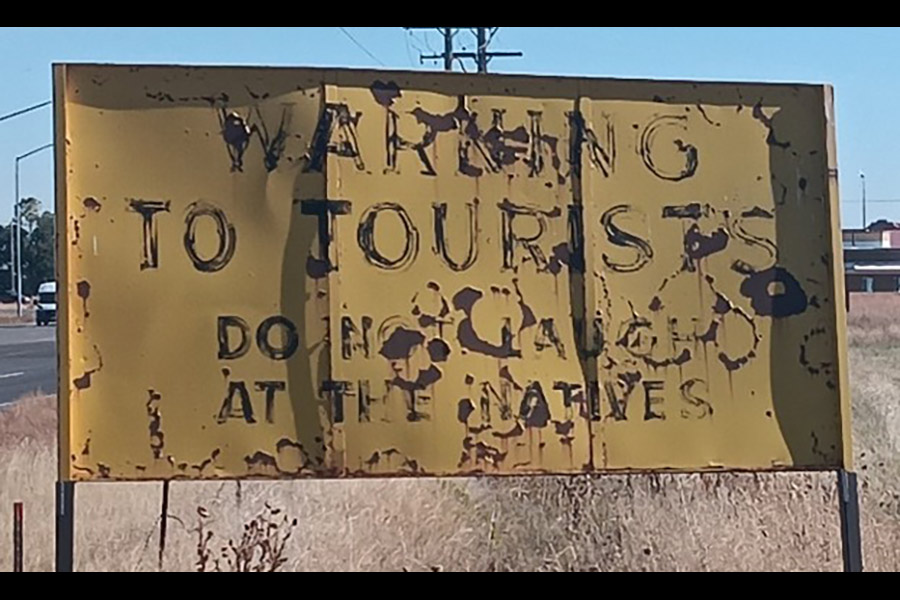 The reverse side of the historic Stinker Station sign, which is currently missing.