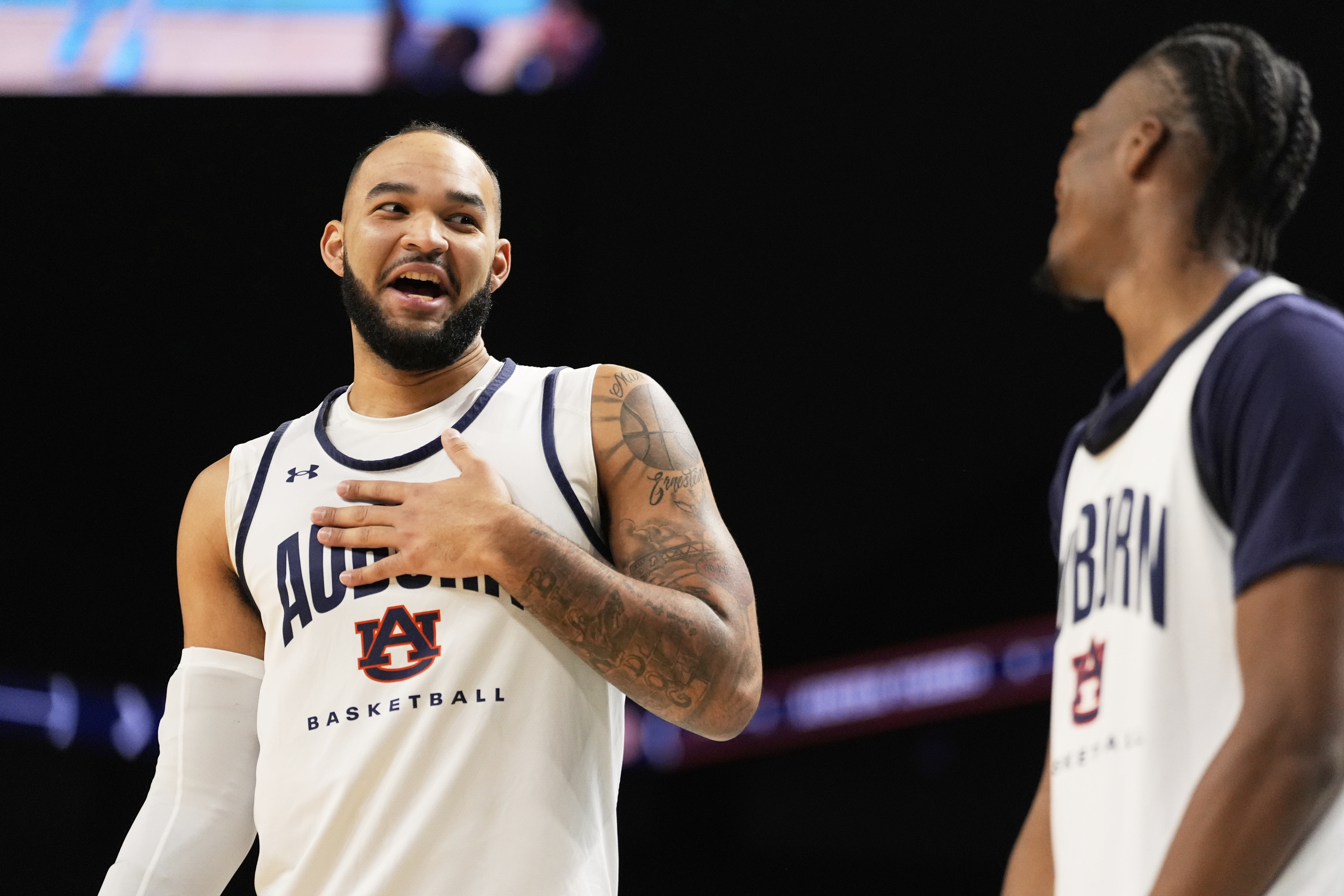 Auburn forward Johni Broome and guard Miles Kelly talks during practice at the Final Four of the NCAA college basketball tournament, Friday, April 4, 2025, in San Antonio.
