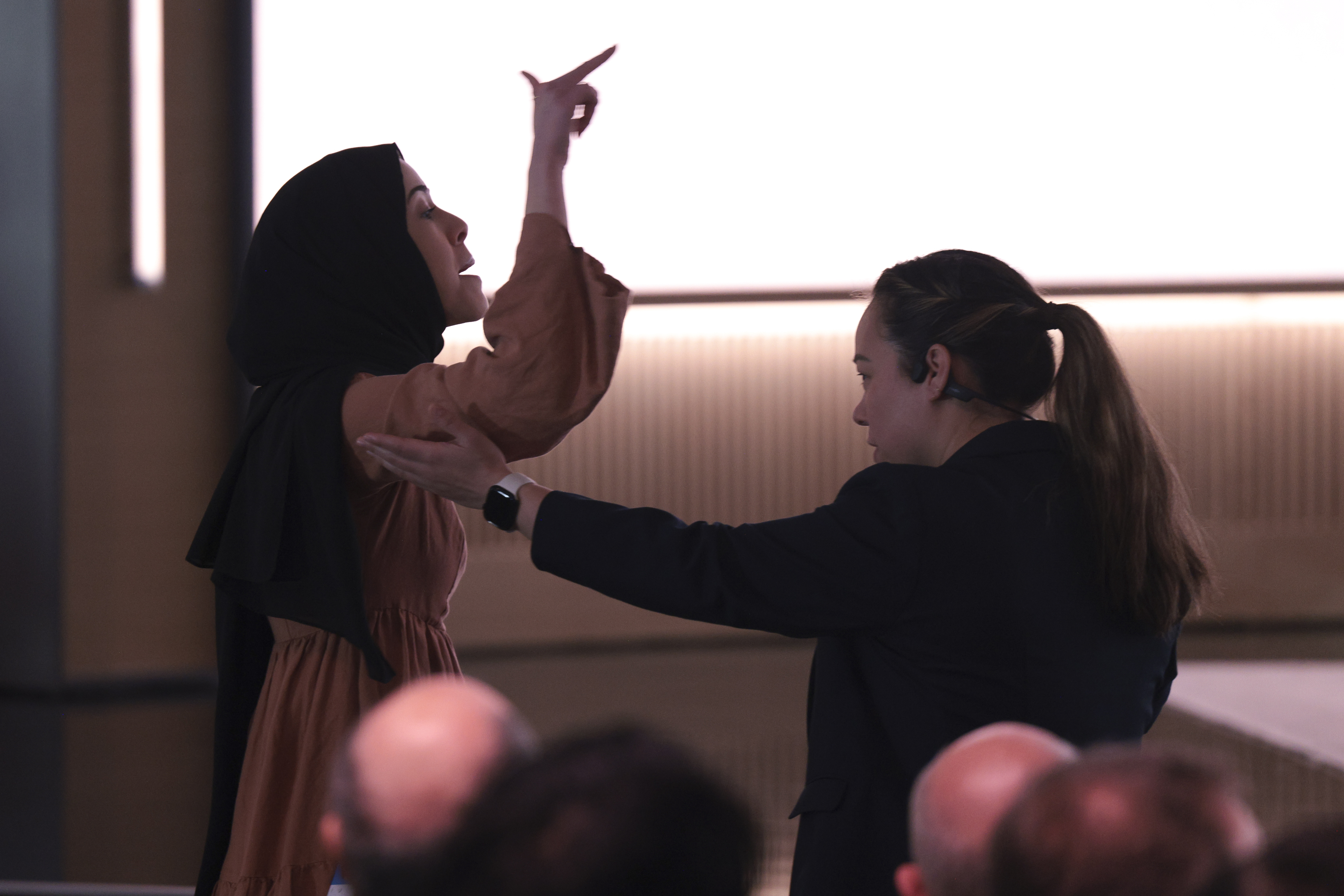 A pro-Palestinian demonstrator is escorted away by security as they interrupt Microsoft AI CEO Mustafa Suleyman during a 50th Anniversary presentation at Microsoft headquarters, Friday in Redmond, Wash.