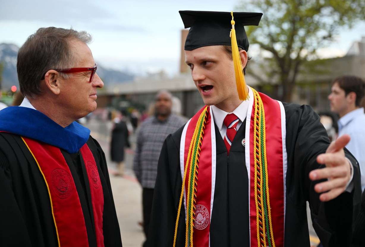 Eron Powell, who graduated with a Bachelor of Science in biology and was the student speaker, talks with University of Utah President Taylor Randall after the commencement at the University of Utah in Salt Lake City on Thursday, May 2, 2024.