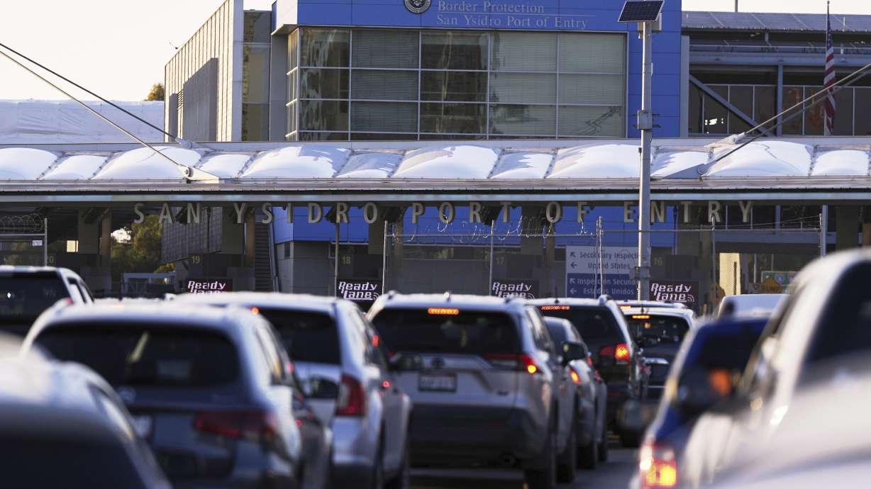 Vehicles wait in line to cross the border into the United States at the San Ysidro Port of Entry, March 18, in Tijuana, Mexico.