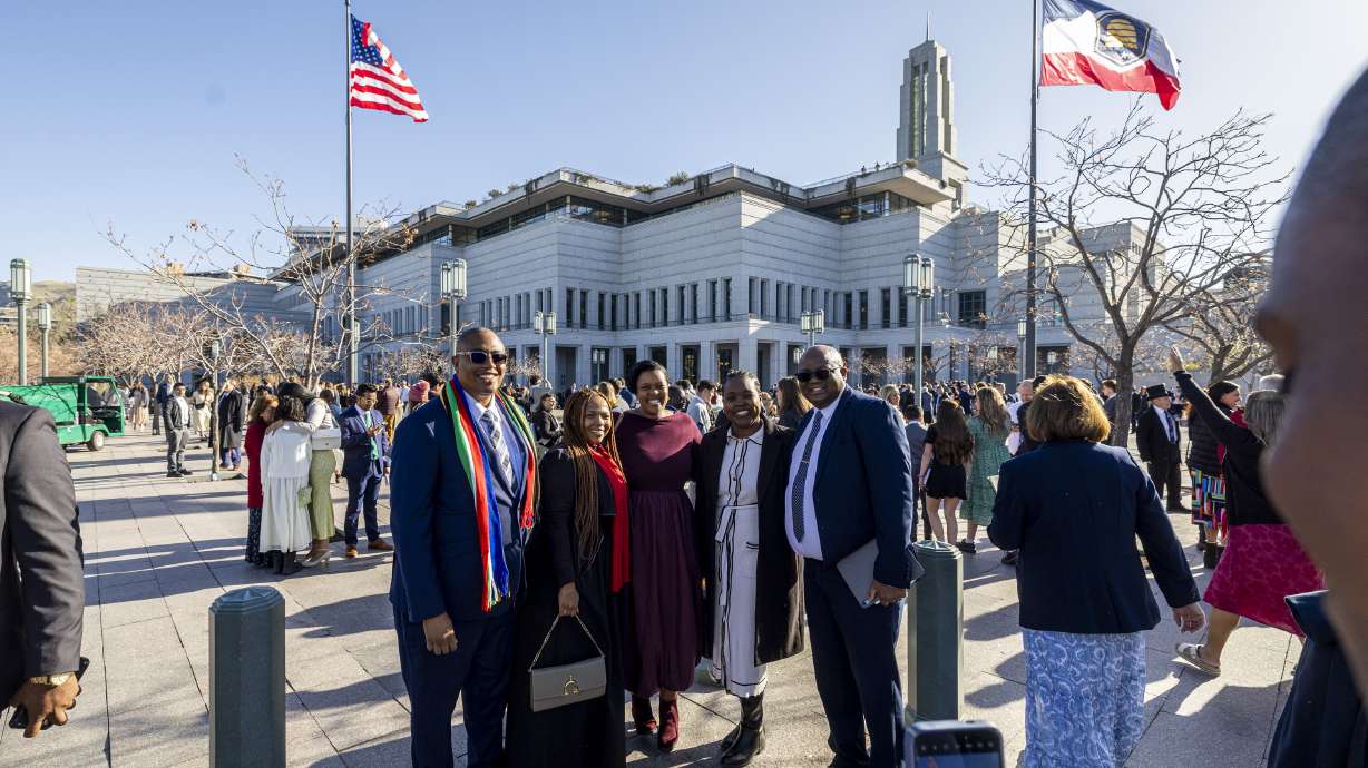 Makasi Sandile, left, poses with other leaders from the Africa South Area for a photo outside the Conference Center before the morning session of the 195th Annual General Conference of The Church of Jesus Christ of Latter-day Saints in Salt Lake City on Saturday.