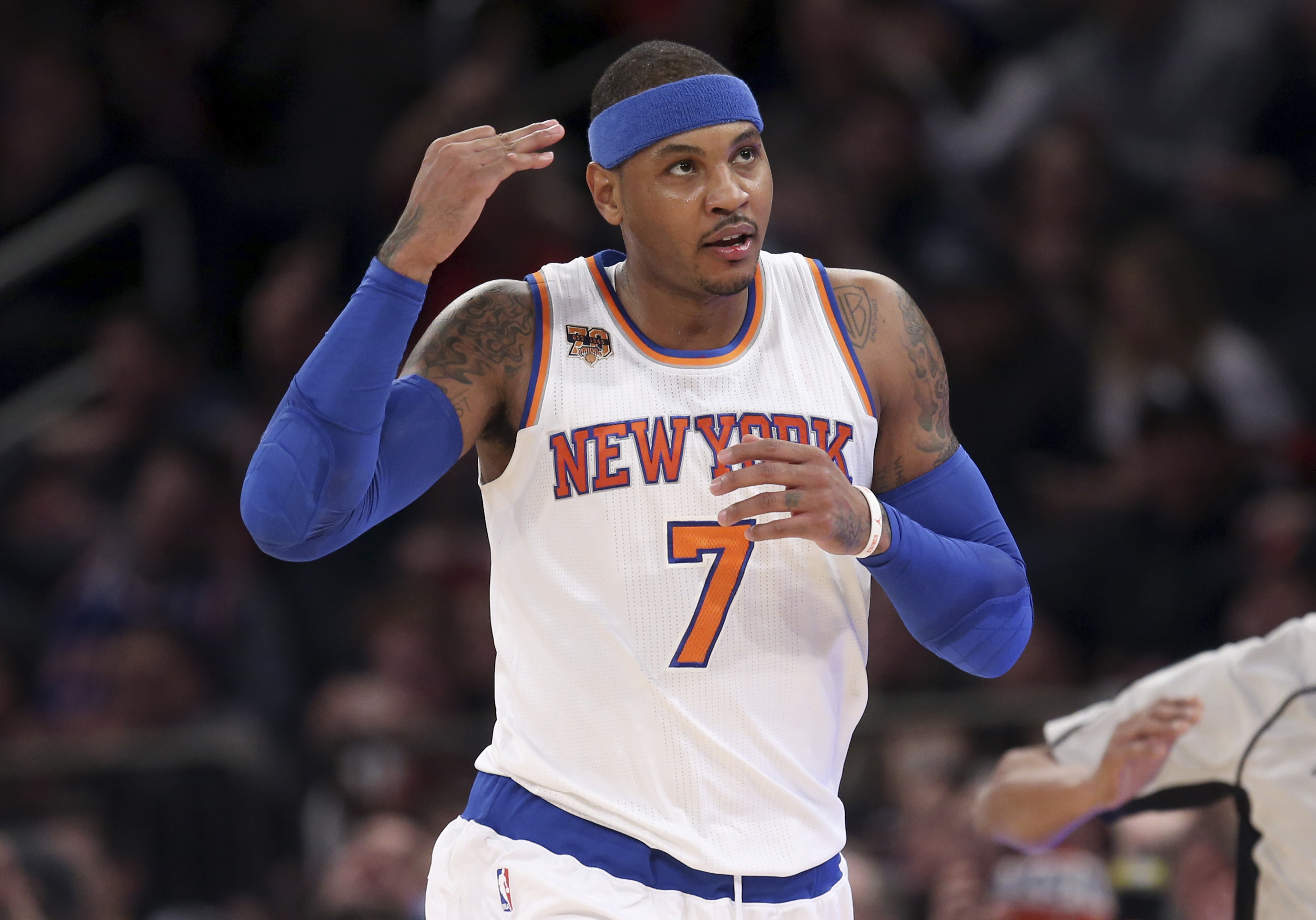 FILE - New York Knicks' Carmelo Anthony reacts after hitting a three-point shot during the first half of the NBA basketball game against the Sacramento Kings, Sunday, Dec. 4, 2016 in New York.