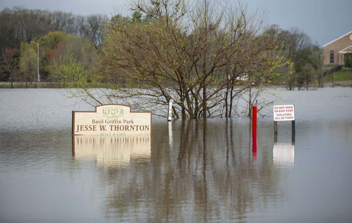 Signs at Basil Griffin Park in Bowling Green, Ky., stand in flooded waters on Friday, after excessive rainfall Thursday into Friday drenched southcentral Kentucky with more than four and a half inches of rain.