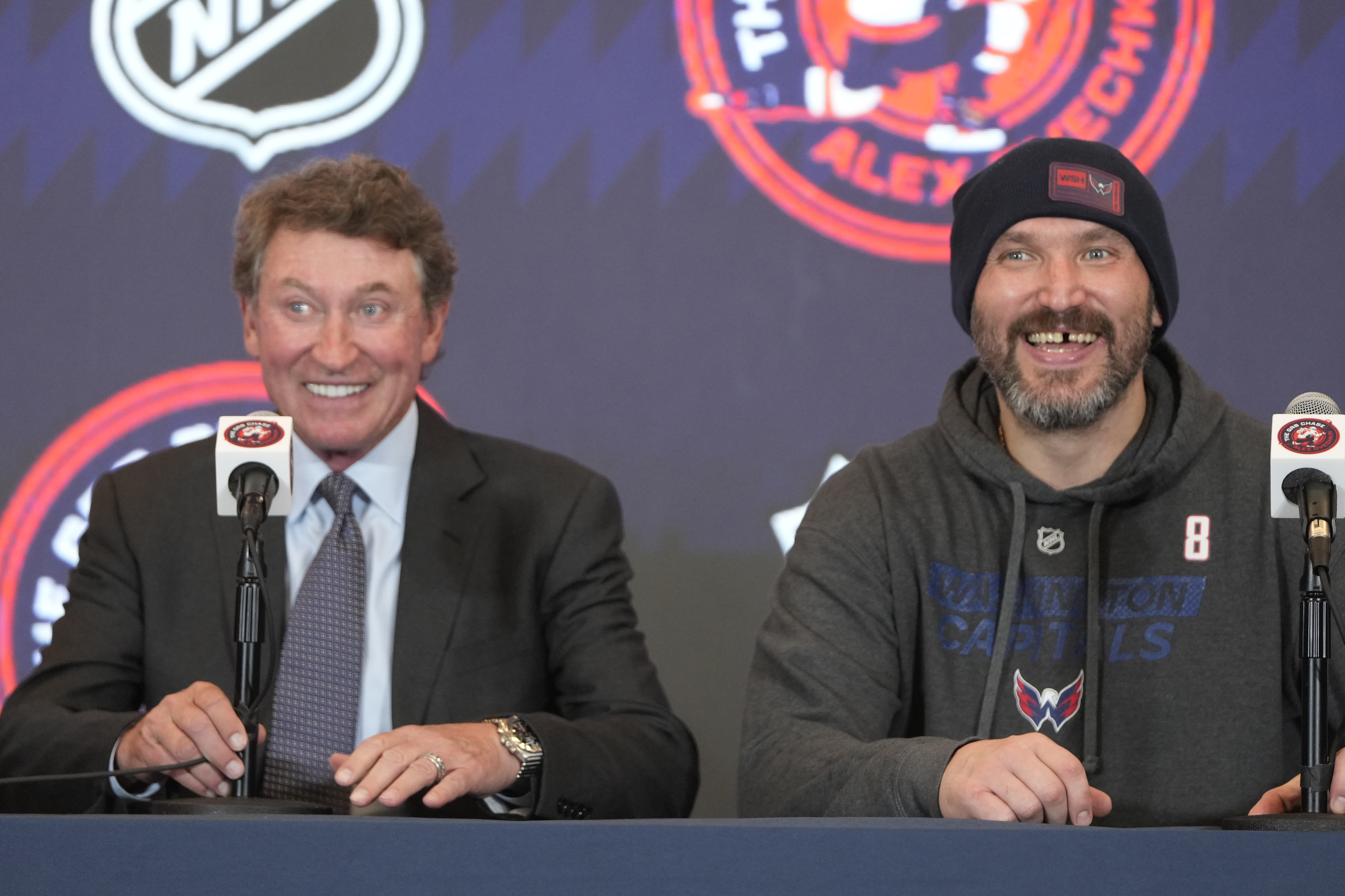 Former NHL player Wayne Gretzky, left, with Washington Capitals Alex Ovechkin, right, during a press conference after an NHL hockey game in which Ovechkin tied Gretzky's NHL career goals record of 894th goals, Friday, April 4, 2025, in Washington.
