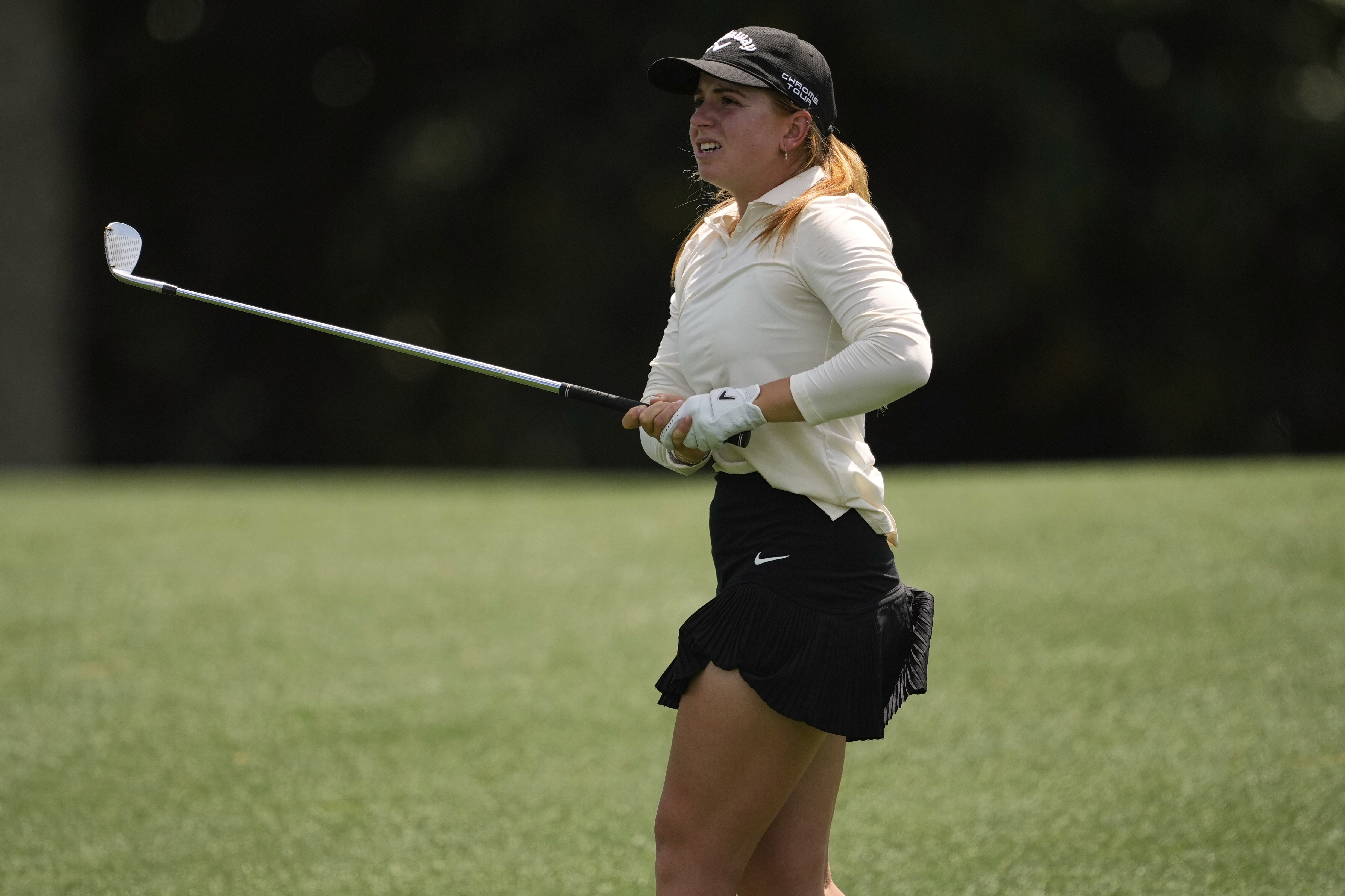 Carla Bernat Escuder, of Spain, follows her shot from the 18th fairway during the final round of the Augusta National Women's Amateur golf tournament, Saturday, April 5, 2025, in Augusta, Ga.