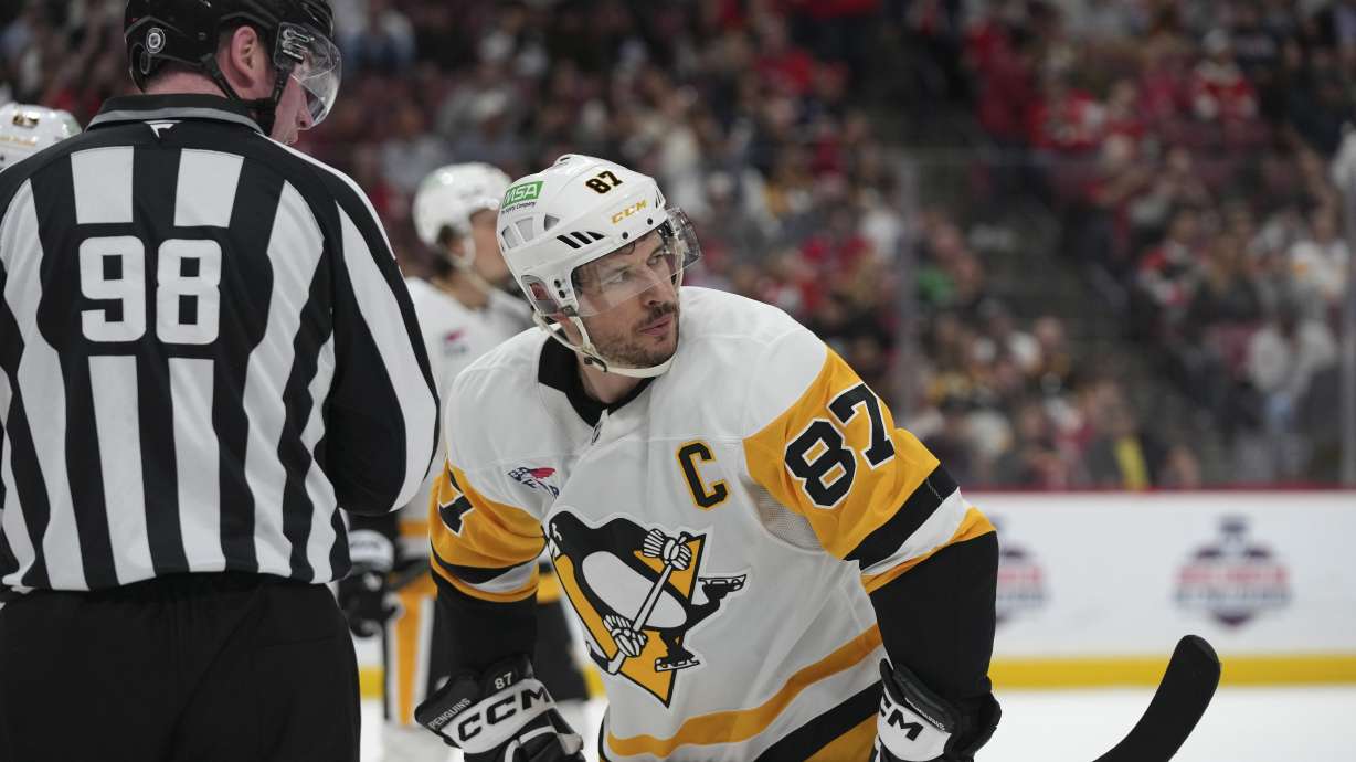 Pittsburgh Penguins center Sidney Crosby (87) talks with an official during the first period of an NHL hockey game against the Florida Panthers, Sunday, March 23, 2025, in Sunrise, Fla.