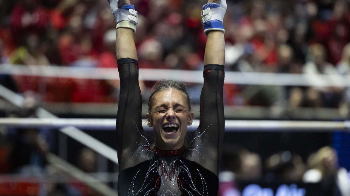 Utah’s Grace McCallum celebrates after dismounting after her bars routine, which would later be scored a 10, during the NCAA gymnastics regionals at the Jon M. Huntsman Center on the campus of the University of Utah in Salt Lake City on Saturday, April 5, 2025.
