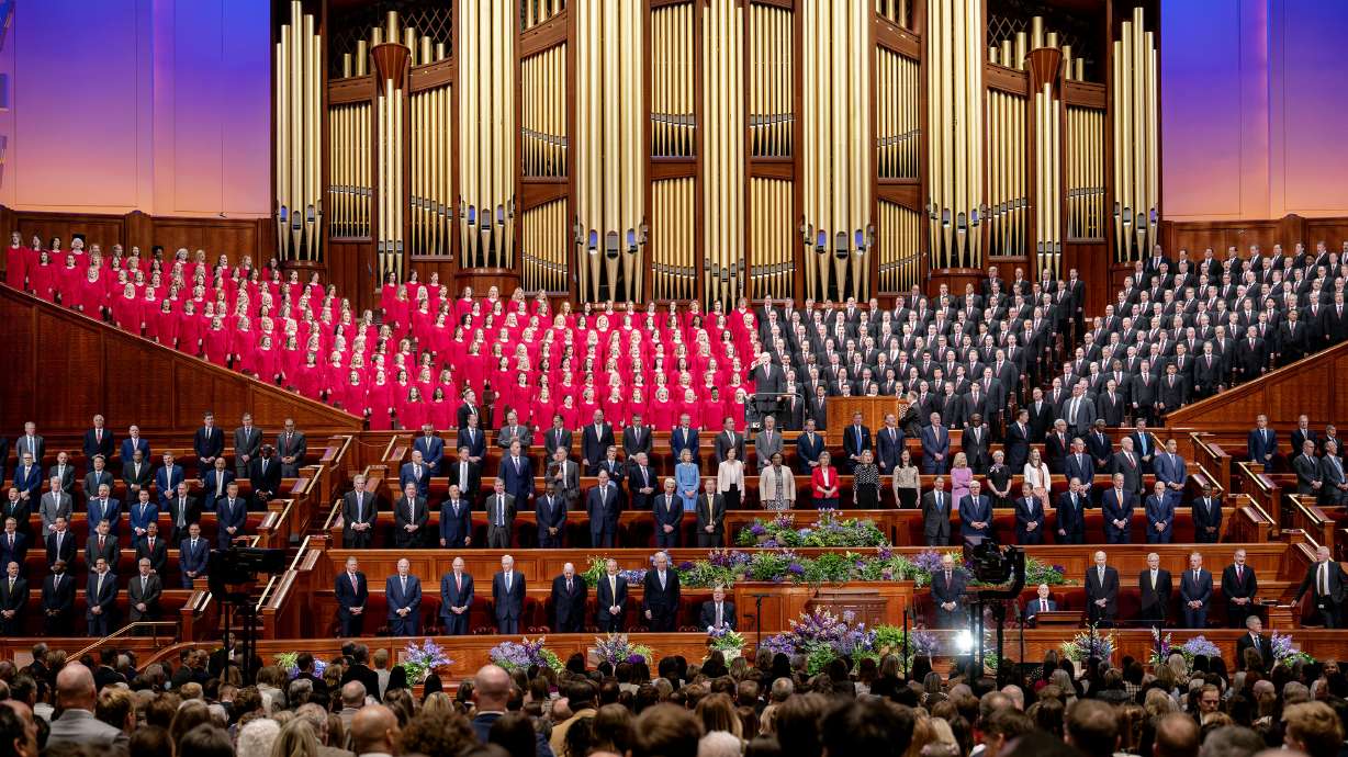 The Tabernacle Choir, church leadership and attendees stand at the Conference Center for a hymn during the morning session of the 195th Annual General Conference of The Church of Jesus Christ of Latter-day Saints in Salt Lake City on Sunday.