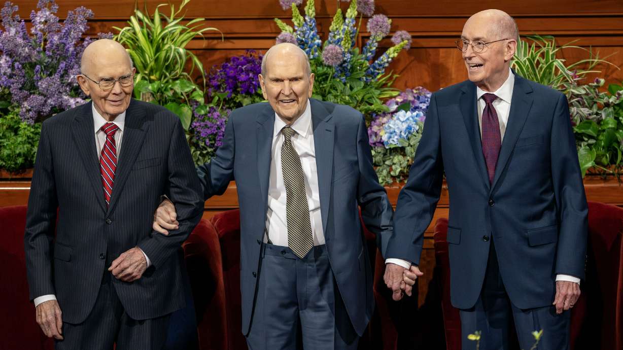 President Russell M. Nelson stands with President Dallin H. Oaks, first counselor in the First Presidency, and President Henry B. Eyring, second counselor, Sunday at the Conference Center in Salt Lake City.