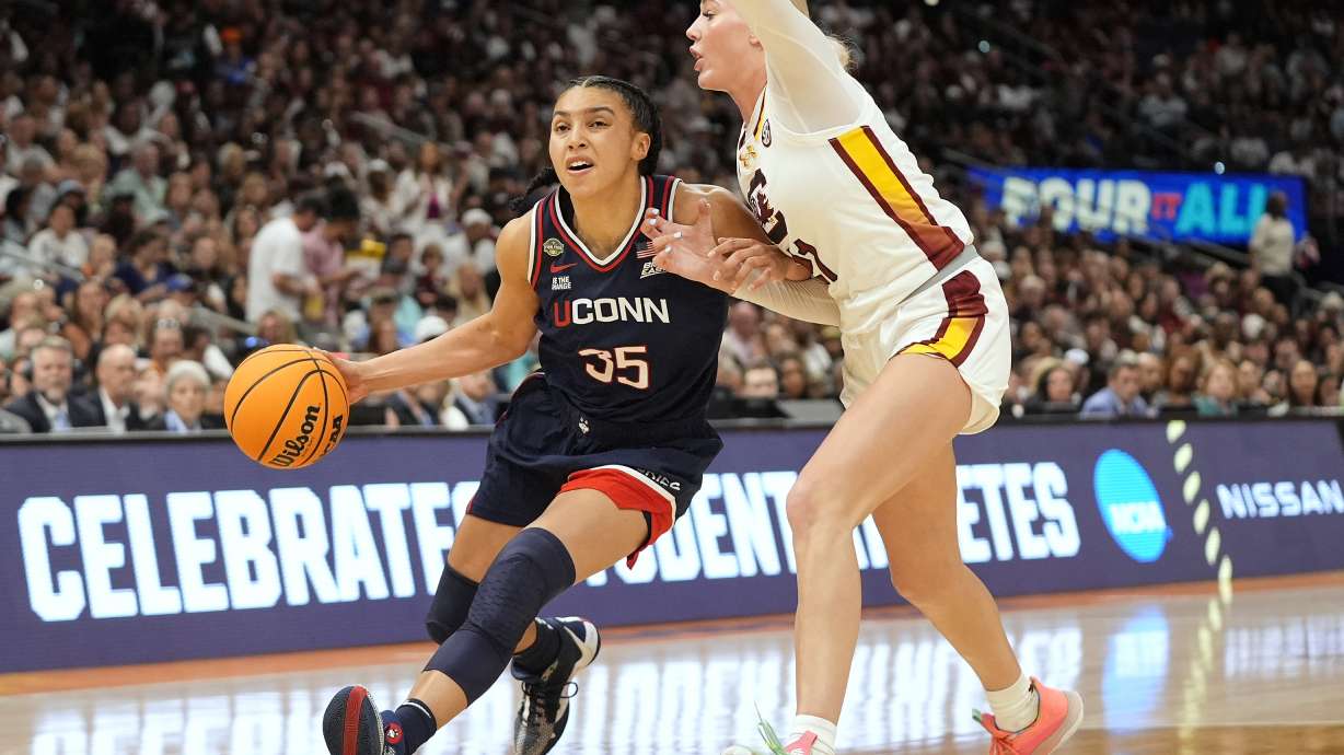 UConn guard Azzi Fudd (35) drives to the basket against South Carolina forward Chloe Kitts (21) during the second half of the national championship game at the Final Four of the women's NCAA college basketball tournament, Sunday, April 6, 2025, in Tampa, Fla.