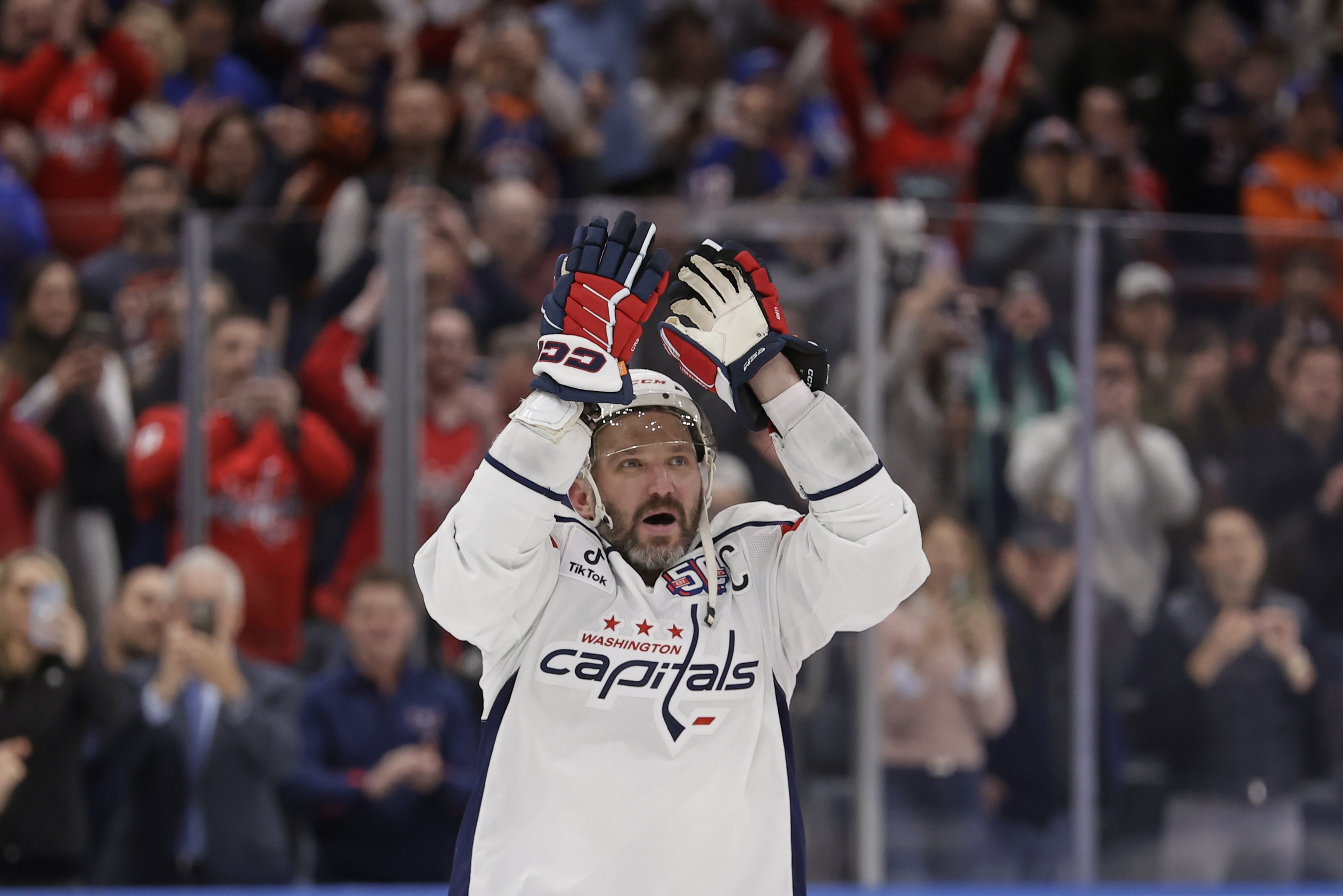 Washington Capitals left wing Alex Ovechkin (8) celebrates after scoring his 895th career goal during the second period of an NHL hockey game against New York Islanders in Elmont, N.Y., Sunday, April 6, 2025.