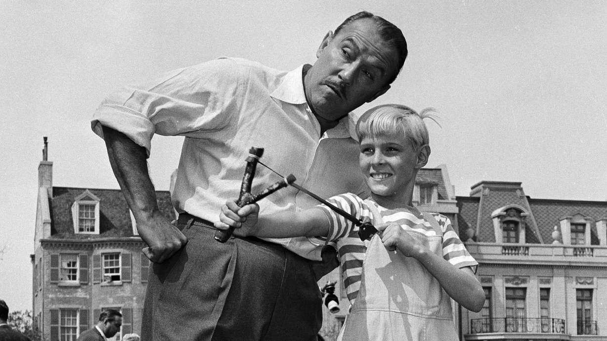 Actor Jay North, in character as Dennis the Menace, shows his ever-present slingshot to show co-star Gale Gordon, on set in Hollywood, March 29, 1962. North has died. He was 73.