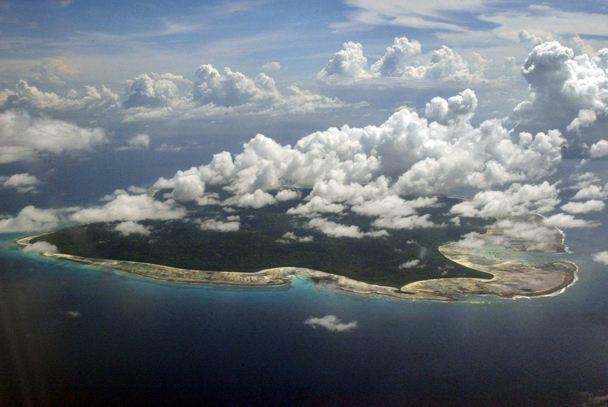 Clouds hang over the North Sentinel Island, in India's southeastern Andaman and Nicobar Islands, Nov. 14, 2005. Indian police have arrested a 24-year-old American YouTuber who visited an off-limits island.