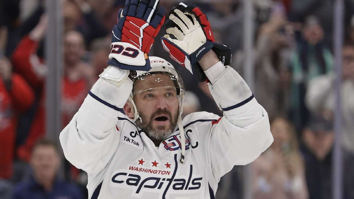 Washington Capitals left wing Alex Ovechkin (8) celebrates after scoring his 895th career goal during the second period of an NHL hockey game against New York Islanders in Elmont, N.Y., Sunday, April 6, 2025.