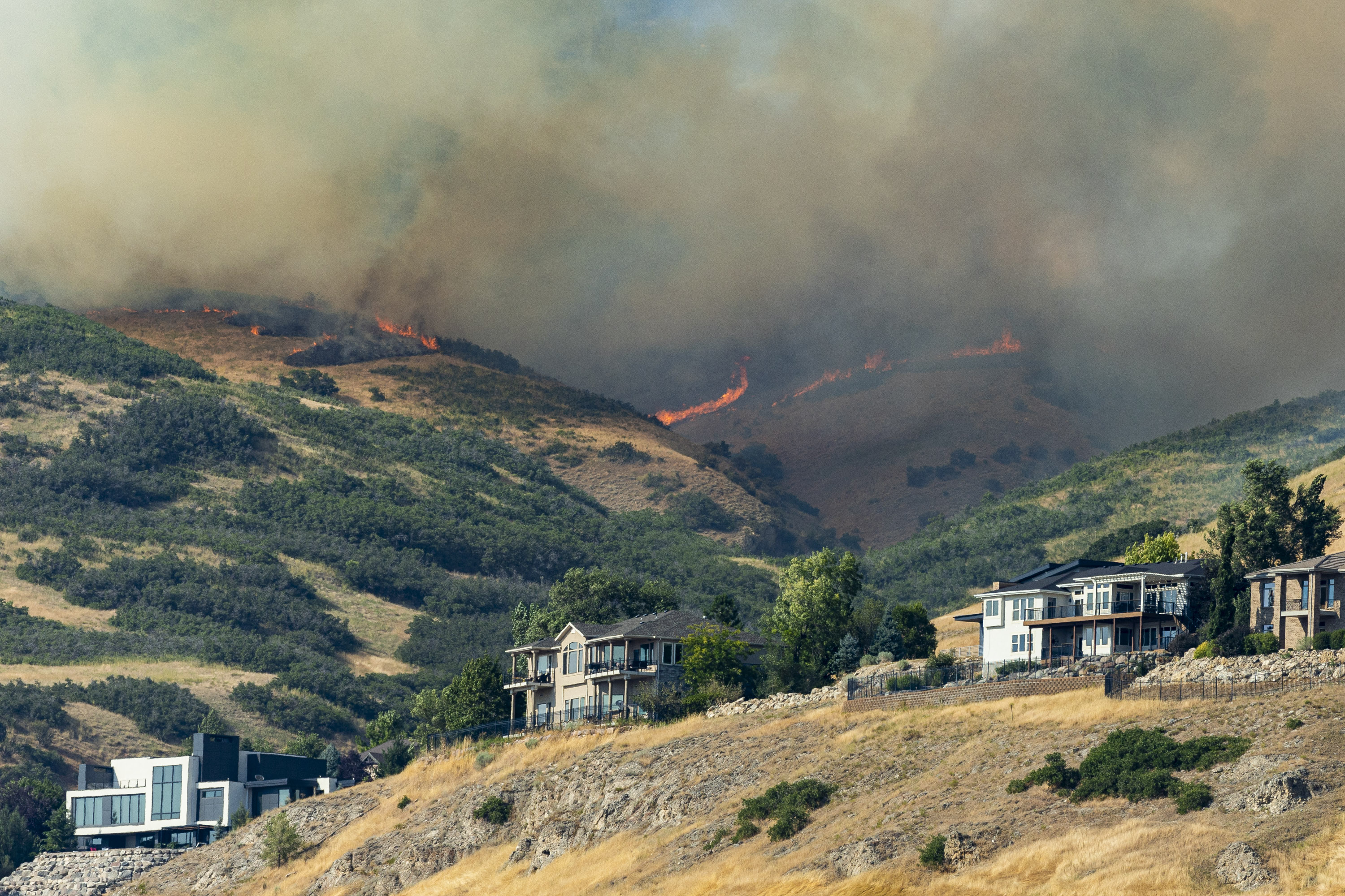 The Sandhurst Fire burns above Ensign Peak north of Salt Lake City on July 20, 2024. Salt Lake firefighters recently outlined the city's high-risk fire areas ahead of the state's typical fire season.
