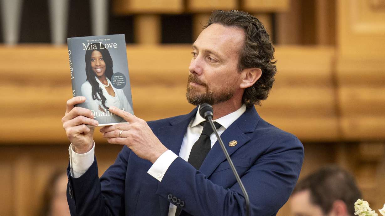 Husband Jason Love speaks at funeral services for former U.S. Rep. Mia Love at the University of Utah Institute of Religion in Salt Lake City on Monday.