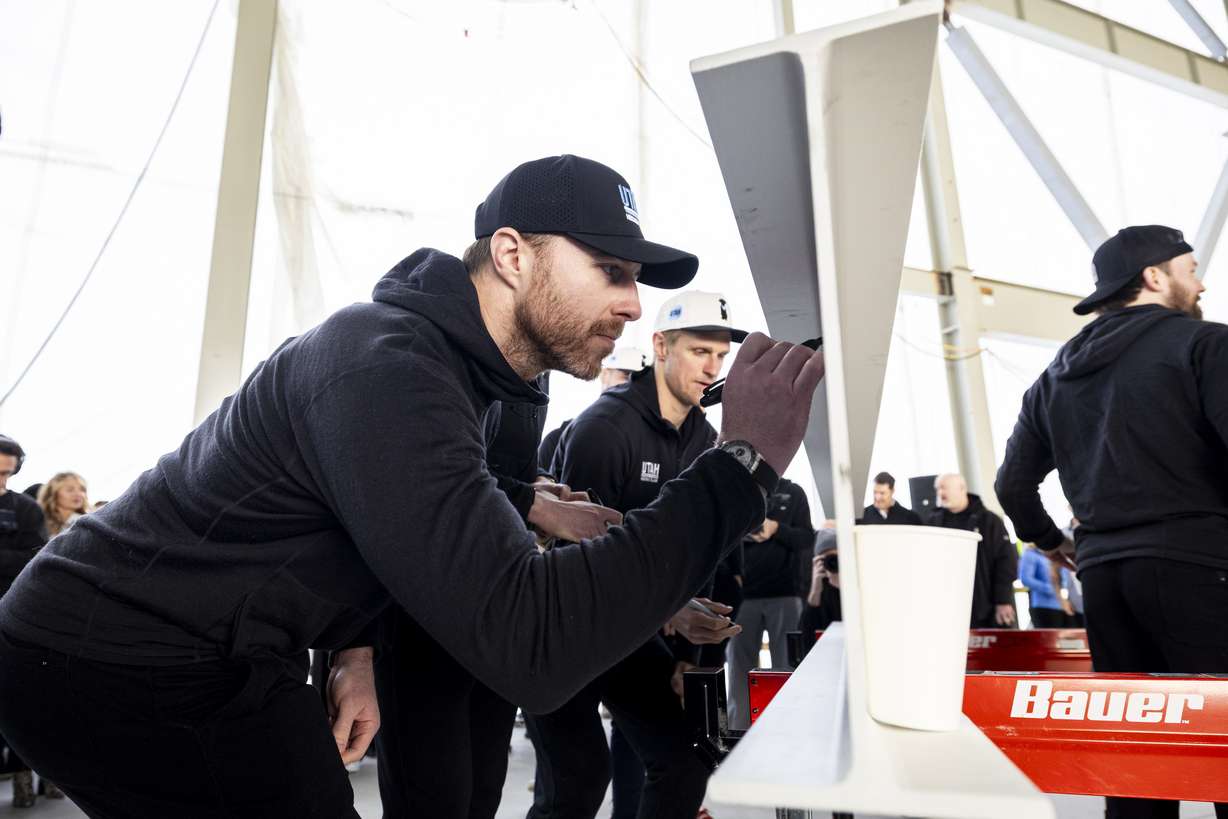 Utah Hockey Club defenseman Ian Cole signs an I-beam during a beam-signing ceremony at the Utah Hockey Club’s new indoor practice facility at The Shops at South Town in Sandy on Monday, April 7, 2025.