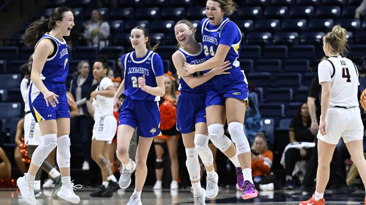 South Dakota State celebrates their win over Oklahoma State in the first round of the NCAA college basketball tournament, Saturday, March 22, 2025, in Storrs, Conn.
