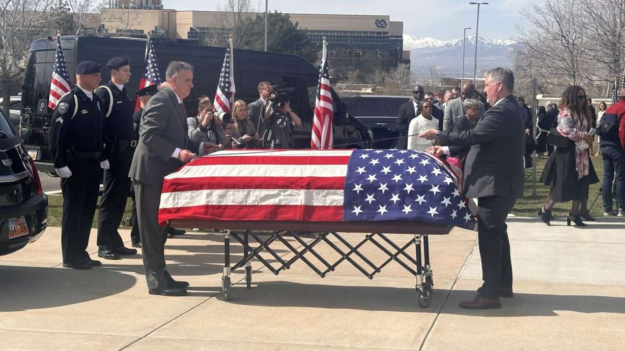 Mia Love’s casket being draped over by the American flag in Salt Lake City on Monday.