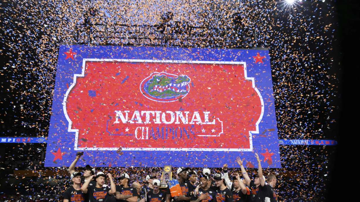 Florida celebrates with the trophy after their win against the Houston in the national championship at the Final Four of the NCAA college basketball tournament, Monday, April 7, 2025, in San Antonio.