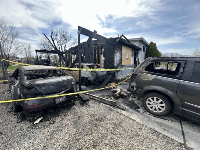 The Carraso family's house burned on Sunday in West Valley City. They inspected the damage on Monday.