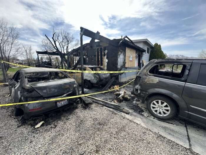 The Carraso family's house burned on Sunday in West Valley City. They inspected the damage on Monday.