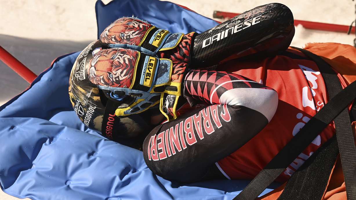 Overall World Cup skiing champion Italy's Federica Brignone is carried away on a toboga after she broke multiple bones in her left leg during a giant slalom crash at the Italian championships in the Lusia ski area, in Val di Fassa, Italy, Thursday, April 3, 2025.