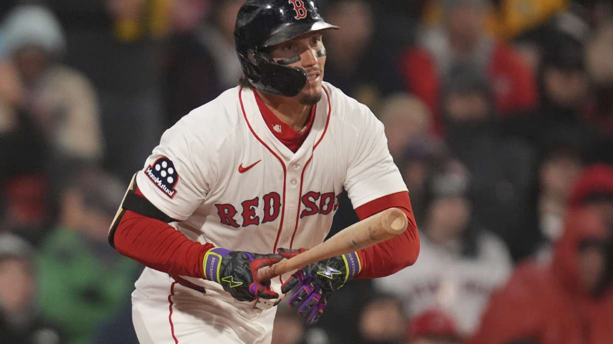 Boston Red Sox's Jarren Duran watches the flight of his double during third inning of a baseball game against the Toronto Blue Jays, Monday, April 7, 2025, in Boston.