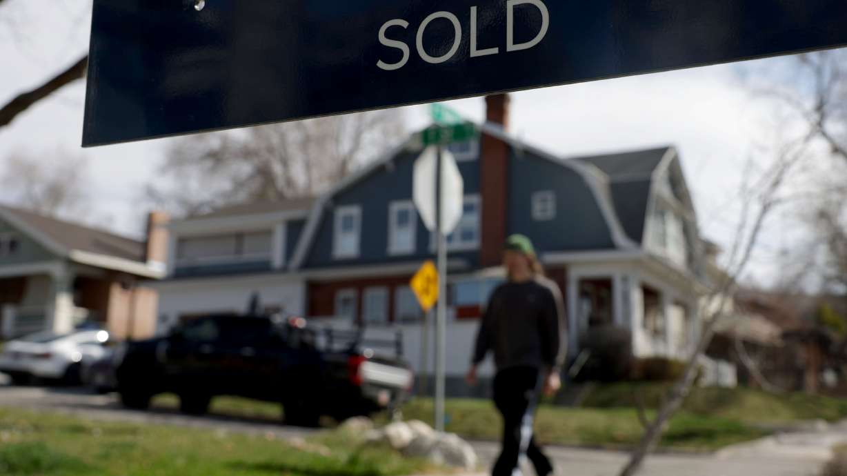 A historical home in the Avenues neighborhood is marked as “sold” in Salt Lake City on March 27. Mortgage rates are headed up again.