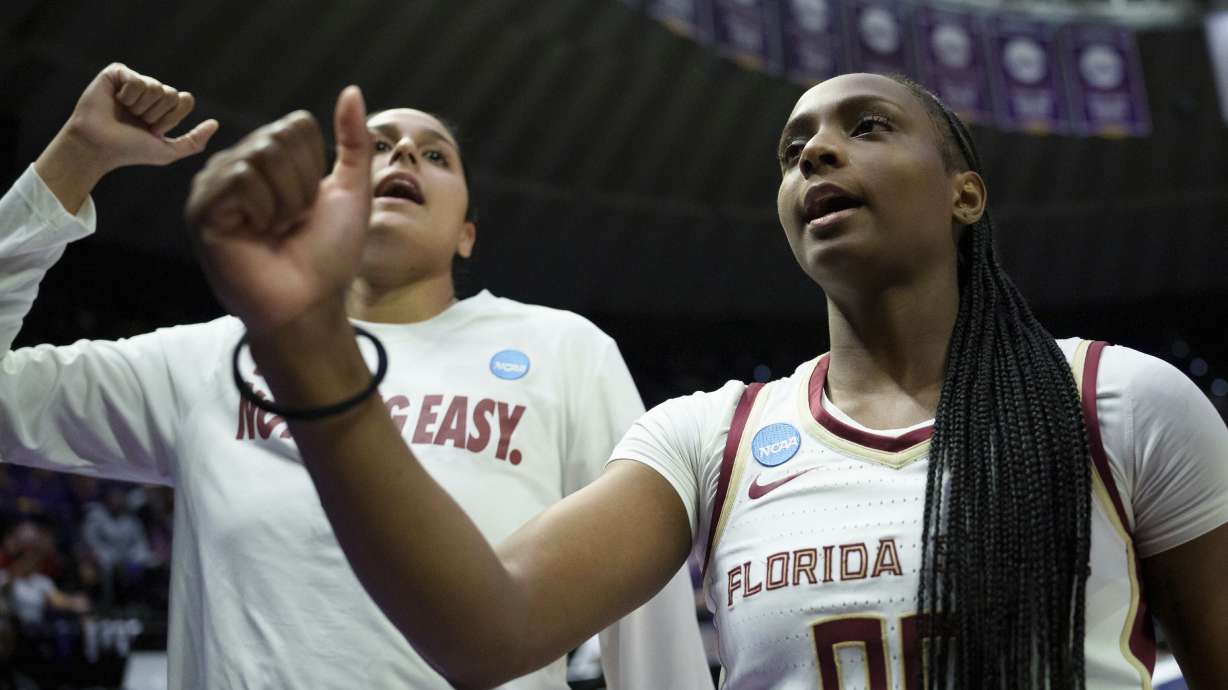 Florida State guard Ta'Niya Latson (00) and her team react after a game against George Mason in the first round of the NCAA college basketball tournament, Saturday, March 22, 2025, in Baton Rouge, La.