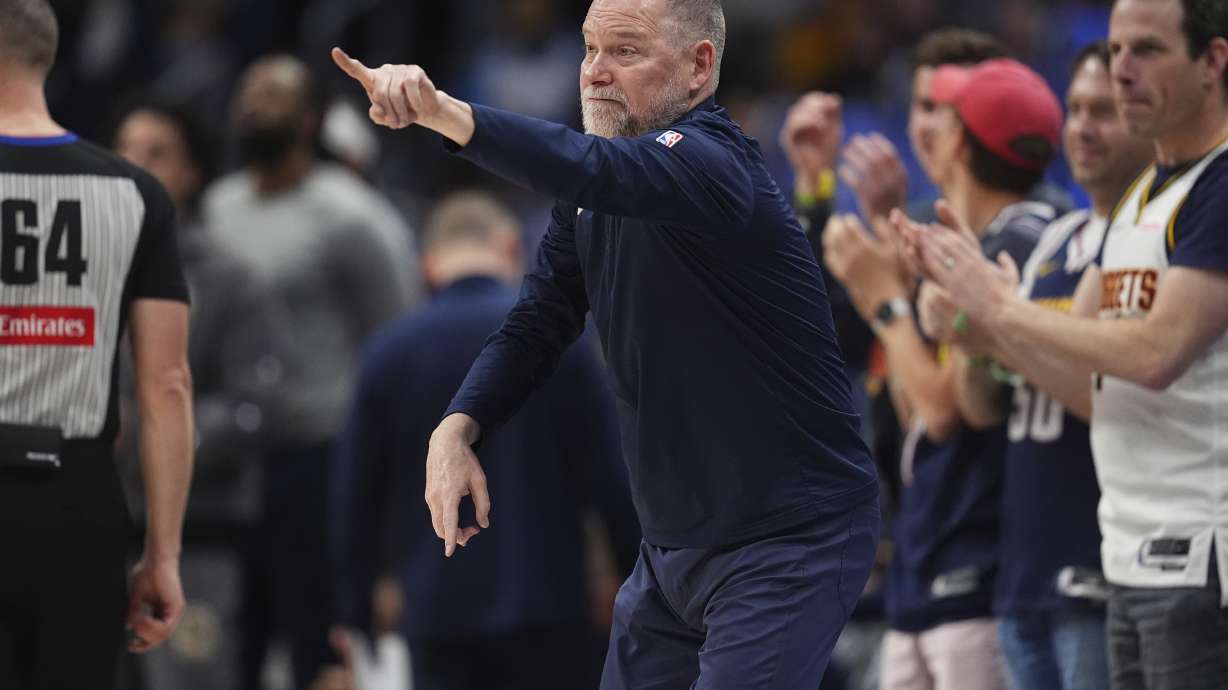 Denver Nuggets head coach Michael Malone directs his team against the Minnesota Timberwolves in the second half of an NBA basketball game Tuesday, April 1, 2025, in Denver.