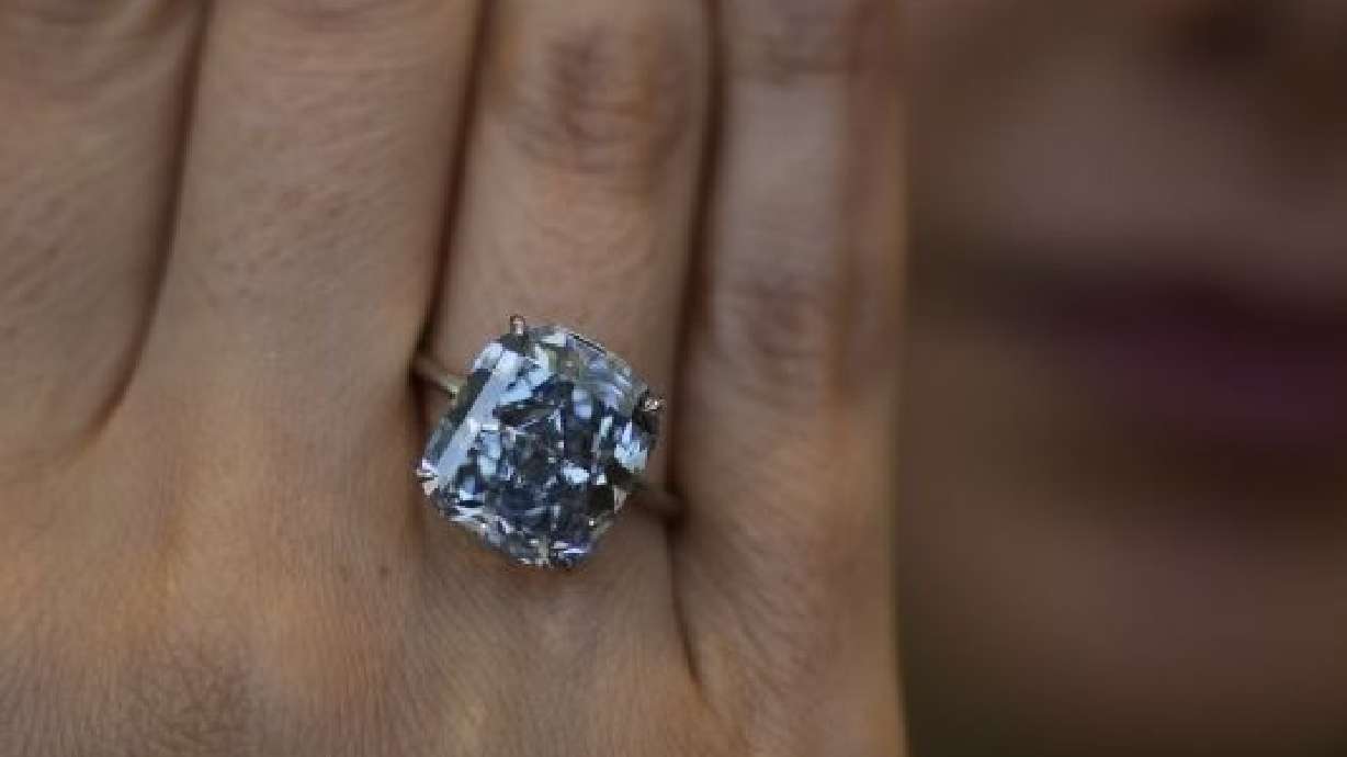Sotheby's deputy chairman, Middle East, and head of Sotheby's UAE, Katia Noun Boueiz, wears the Mediterranean Blue diamond during its worldwide debut in Abu Dhabi, United Arab Emirates, Tuesday.