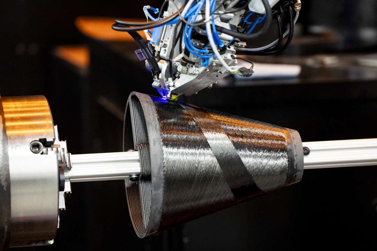 A continuous composite robot creates a rocket motor exit cone during an open house hosted by Weber State University and 47G held at the Miller Advanced Research & Solutions (MARS) Center near Hill Air Force Base in Clearfield on April 3.