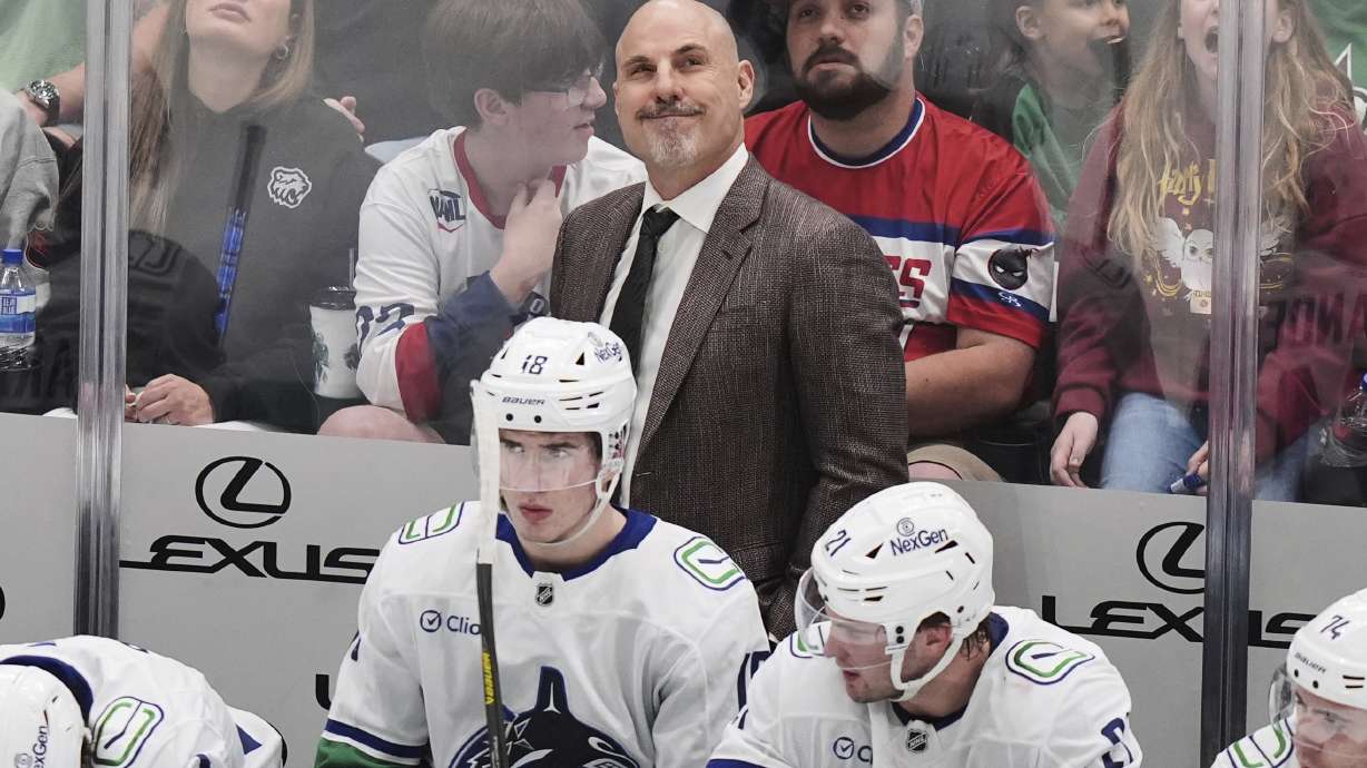 Vancouver Canucks head coach Rick Tocchet reacts to play against the Dallas Stars in the third period of an NHL hockey game in Dallas, Tuesday, April 8, 2025.