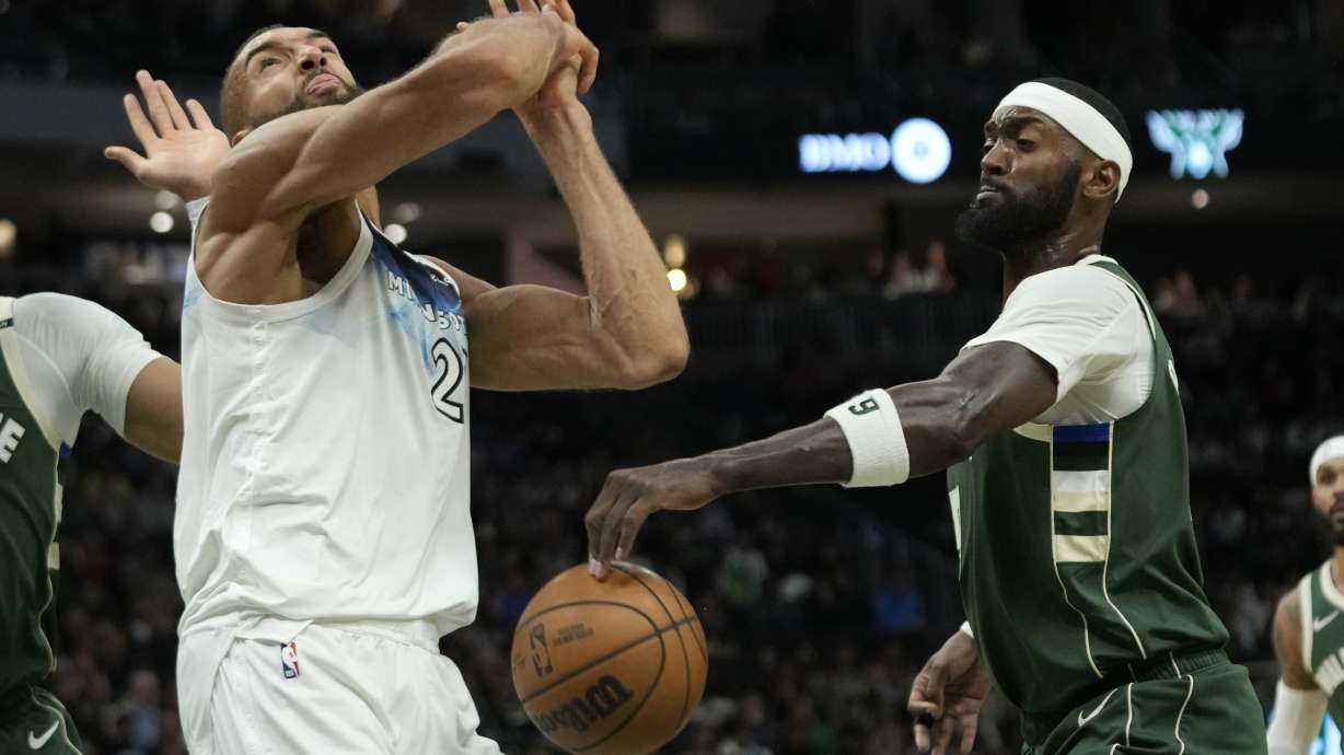Milwaukee Bucks' Bobby Portis, right, strips the ball from Minnesota Timberwolves' Rudy Gobert during the second half of an NBA basketball game Tuesday, April 8, 2025, in Milwaukee.