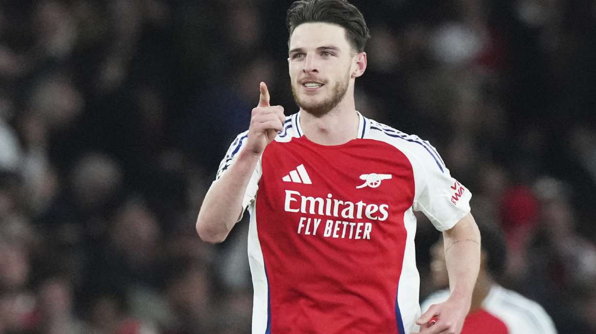Arsenal's Declan Rice celebrates after scoring his side's second goal during the Champions League quarterfinal first leg soccer match between Arsenal and Real Madrid at the Emirates Stadium in London, Tuesday, April 8, 2025.