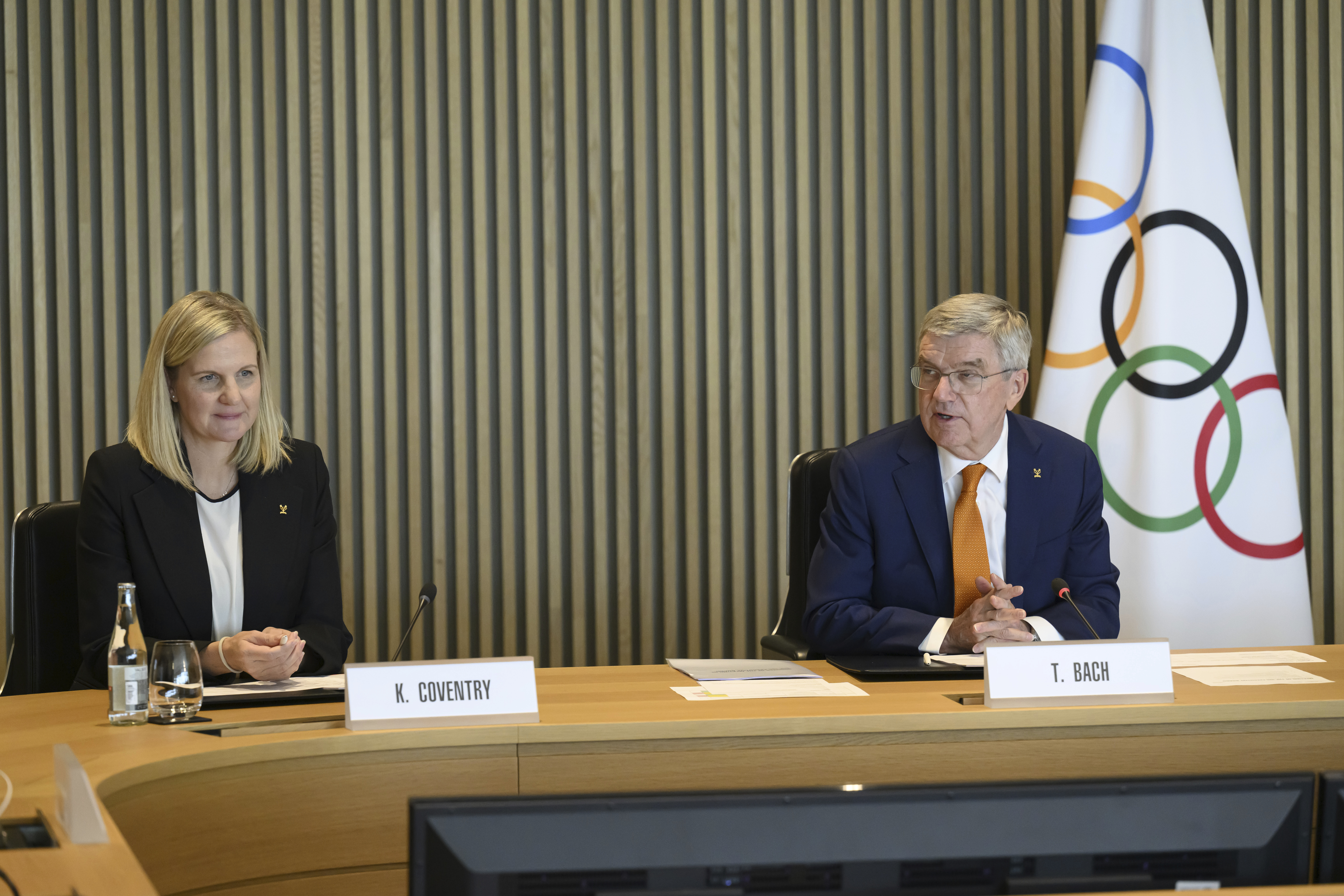 International Olympic Committee (IOC) President Thomas Bach, right, speaks next to the president-elect of the International Olympic Committee (IOC) Kirsty Coventry, left, at the opening of the executive board meeting of the International Olympic Committee (IOC), at the Olympic House, in Lausanne, Switzerland, Wednesday, April 9, 2025.