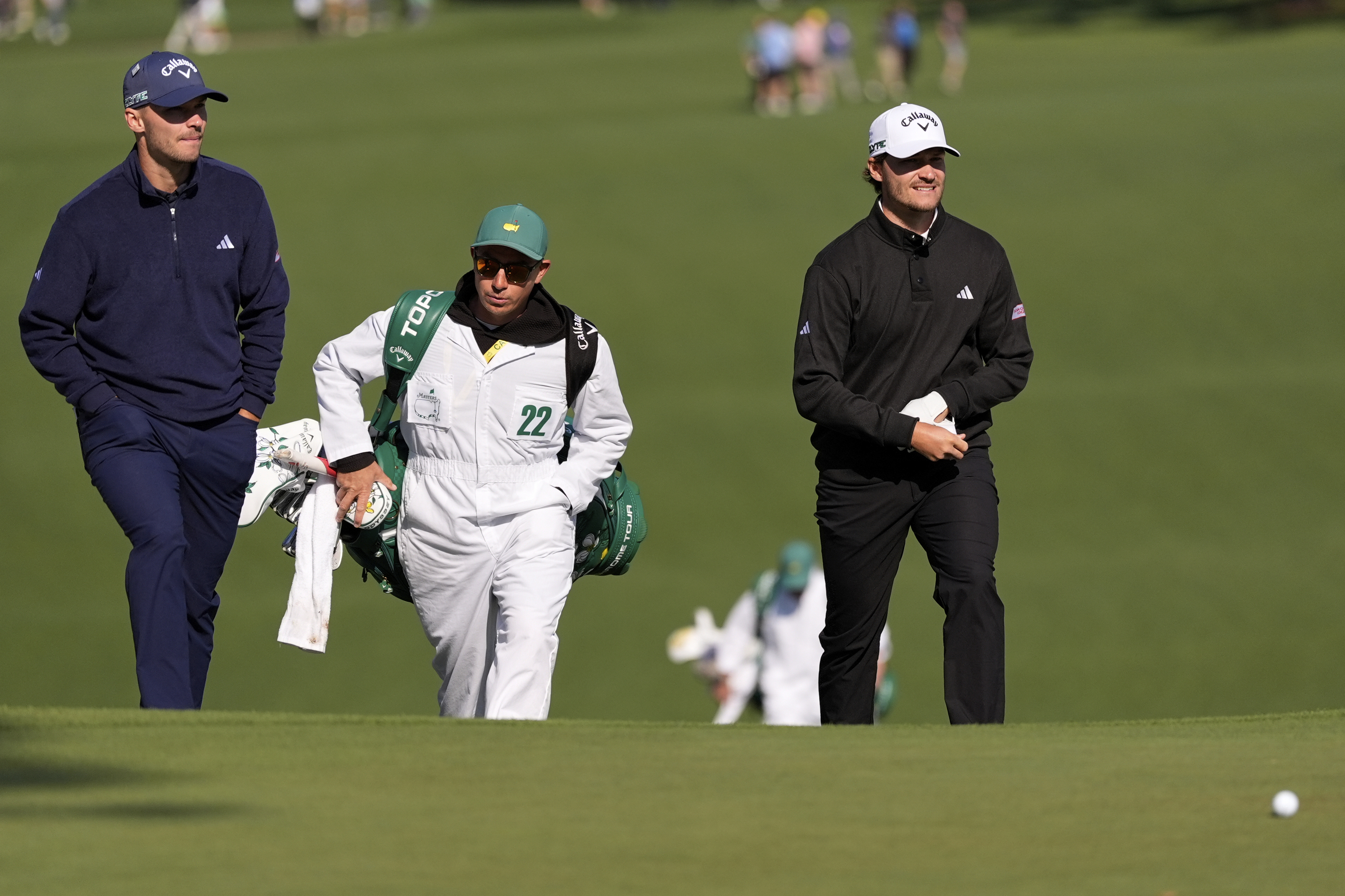 Rasmus Hojgaard, right, and Nicolai Hojgaard walk to the green on the seventh hole during a practice around at the Masters golf tournament, Wednesday, April 9, 2025, in Augusta, Ga. 