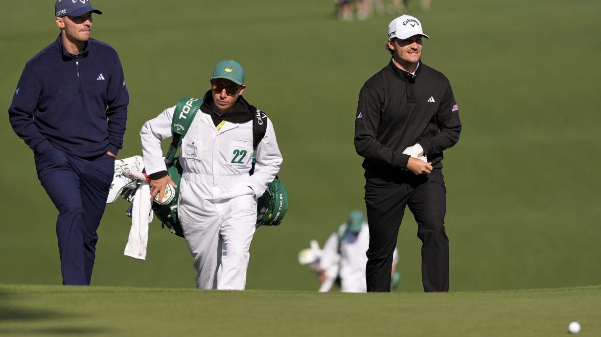 Rasmus Hojgaard, right, and Nicolai Hojgaard walk to the green on the seventh hole during a practice around at the Masters golf tournament, Wednesday, April 9, 2025, in Augusta, Ga.