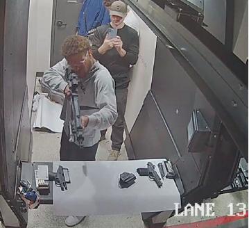 A still photo of security camera footage allegedly showing Tyler Thompson Jr. filming Marcel Malanga while he shoots an AR-15 rifle at a West Jordan shooting range March 9, 2024.