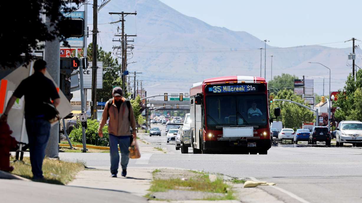 A Utah Transit Authority bus travels east on 3500 South at Redwood Road in West Valley City on June 26, 2023. Leaders of the Crossroads Urban Center sent UTA leaders a letter last week urging the agency to pause its proposed fare increase until it increases outreach over discounted passes.