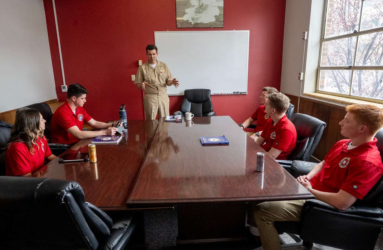 Capt. Daniel A. Nowicki, commander of the University of Utah’s Navy ROTC, talks with students Brytani M. Musick, Gunnery Sergeant USMC, Sergeant Marcos Van Dalen USMC, MIDN 1/C Ethan Ogzewalla USN, Officer Candidate Jeremiah Whisenhunt USN, and MIDN 1/C Dave Spong USN, during their class at the Naval Science Building in Salt Lake City on April 1.