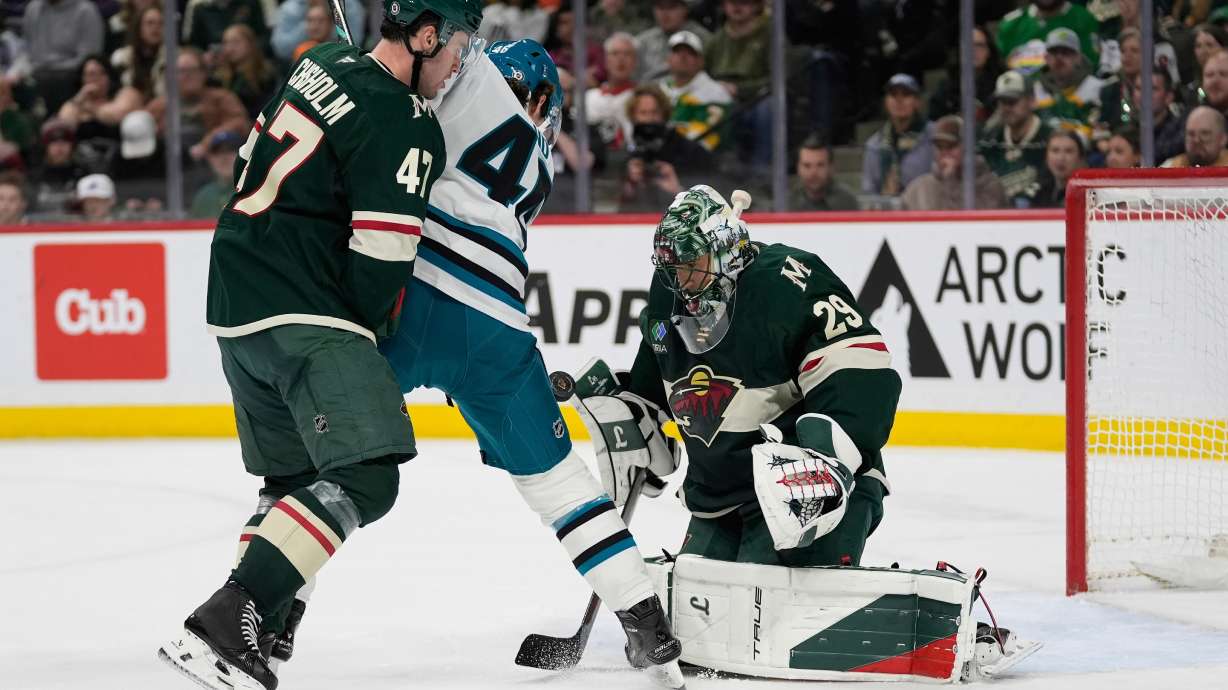 Minnesota Wild goaltender Marc-Andre Fleury (29) defends against a shot as San Jose Sharks center Cam Lund (46) pressures during the second period of an NHL hockey game, Wednesday, April 9, 2025, in St. Paul, Minn.