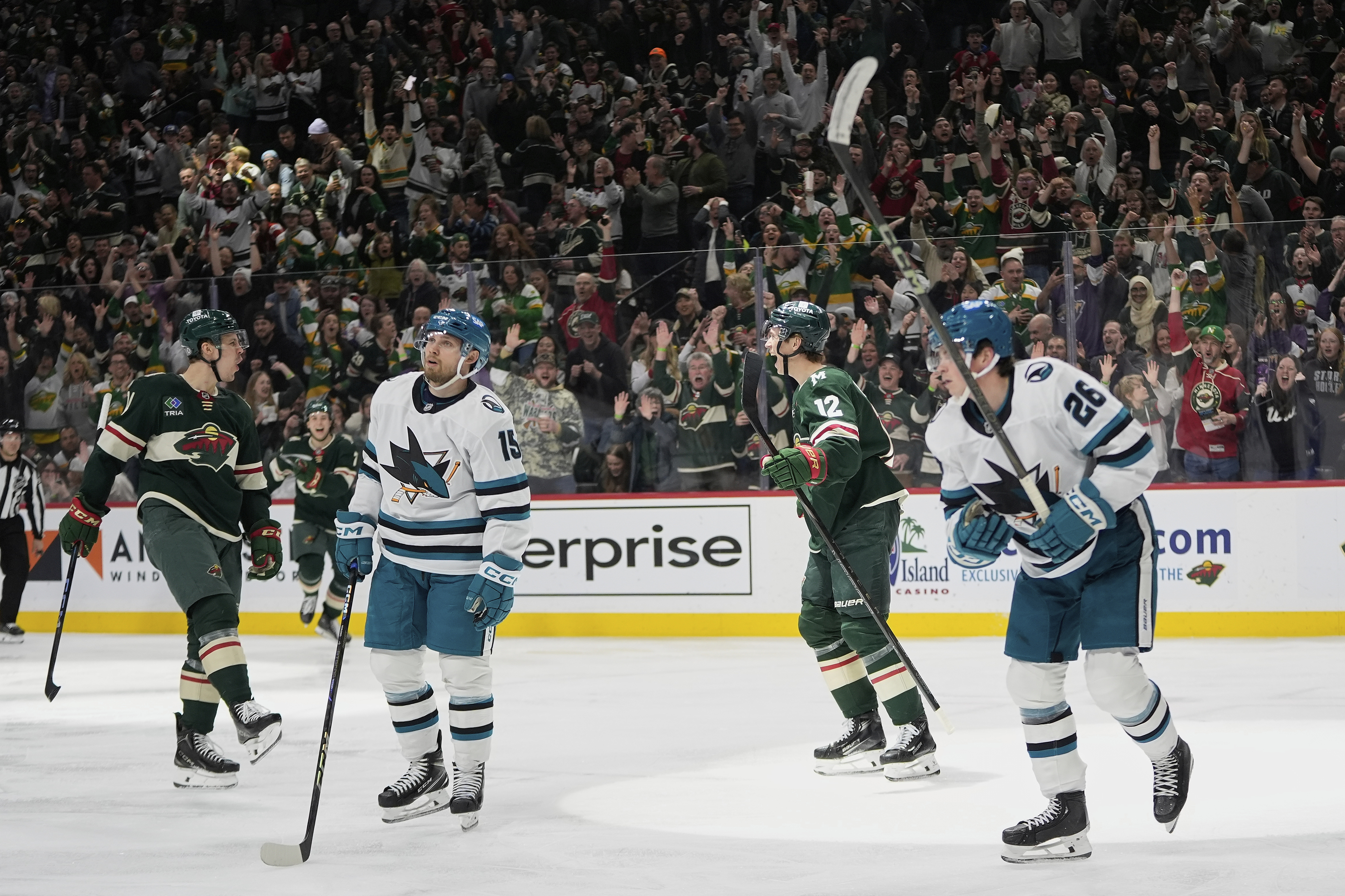 Minnesota Wild center Joel Eriksson Ek (14), left, celebrates toward left wing Matt Boldy (12) after scoring a goal during the third period of an NHL hockey game against the San Jose Sharks, Wednesday, April 9, 2025, in St. Paul, Minn.