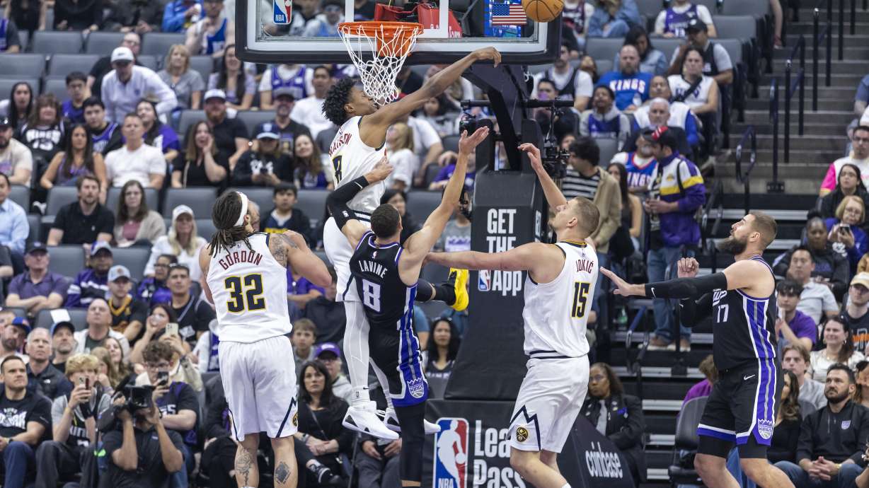 Denver Nuggets forward Peyton Watson (8) blocks Sacramento Kings guard Zach LaVine's (8) layup during the first half of an NBA basketball game Wednesday, April 9, 2025, in Sacramento, Calif.