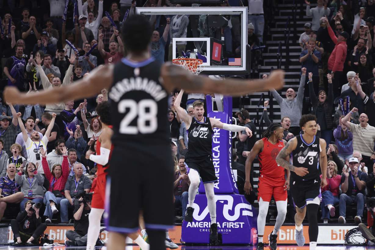 Utah Jazz forward Kyle Filipowski (22) reacts to a dunk against the Portland Trail Blazers during overtime of an NBA basketball game, Wednesday, April 9, 2025, in Salt Lake City.